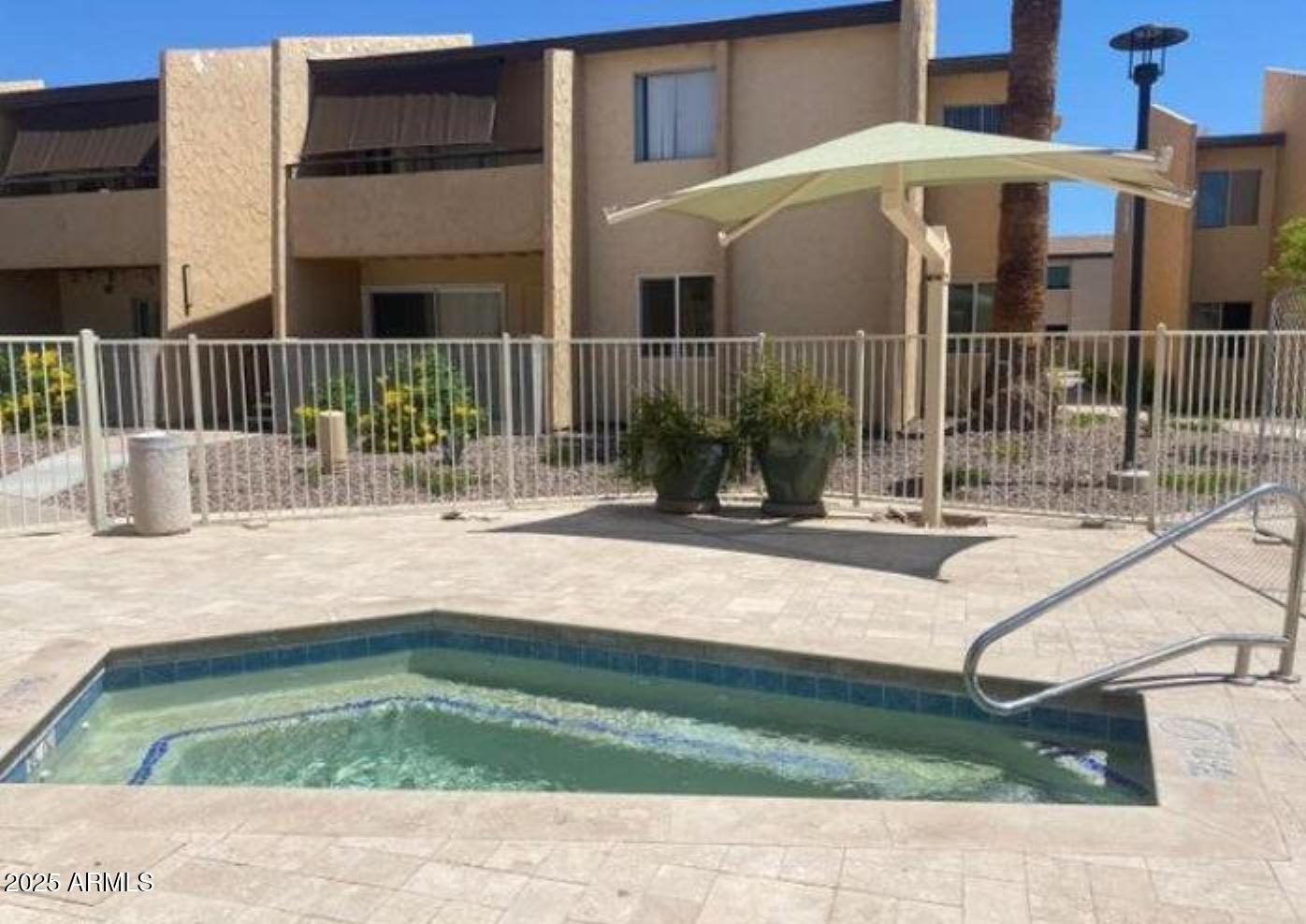 8055 East Thomas Road, Unit A303 Scottsdale, AZ 85251 - Photo 13 of 25 a view of a house with backyard