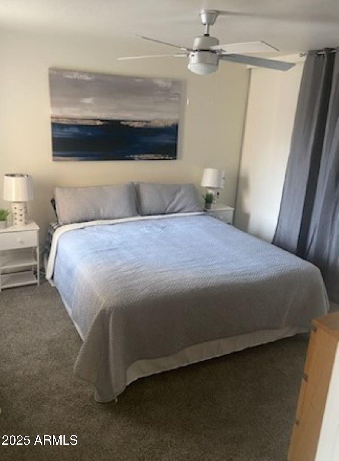 8055 East Thomas Road, Unit A303 Scottsdale, AZ 85251 - Photo 19 of 25 a bedroom with a bed and a window