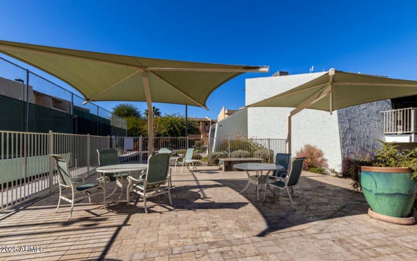 8055 East Thomas Road, Unit A303 Scottsdale, AZ 85251 - Photo 22 of 25 a view of outdoor space yard deck patio and outdoor kitchen