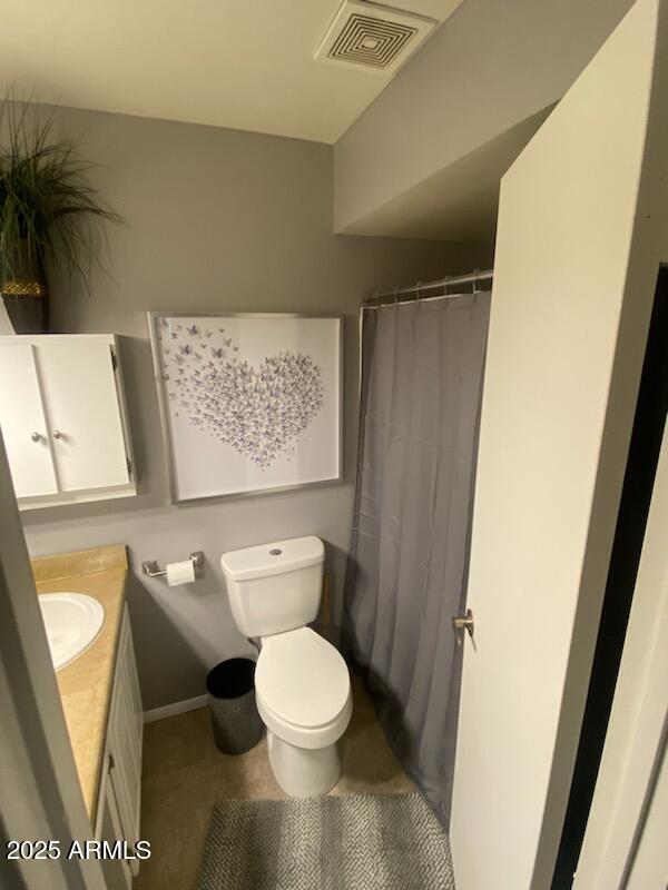 8055 East Thomas Road, Unit A303 Scottsdale, AZ 85251 - Photo 4 of 25 a white toilet sitting next to a shower