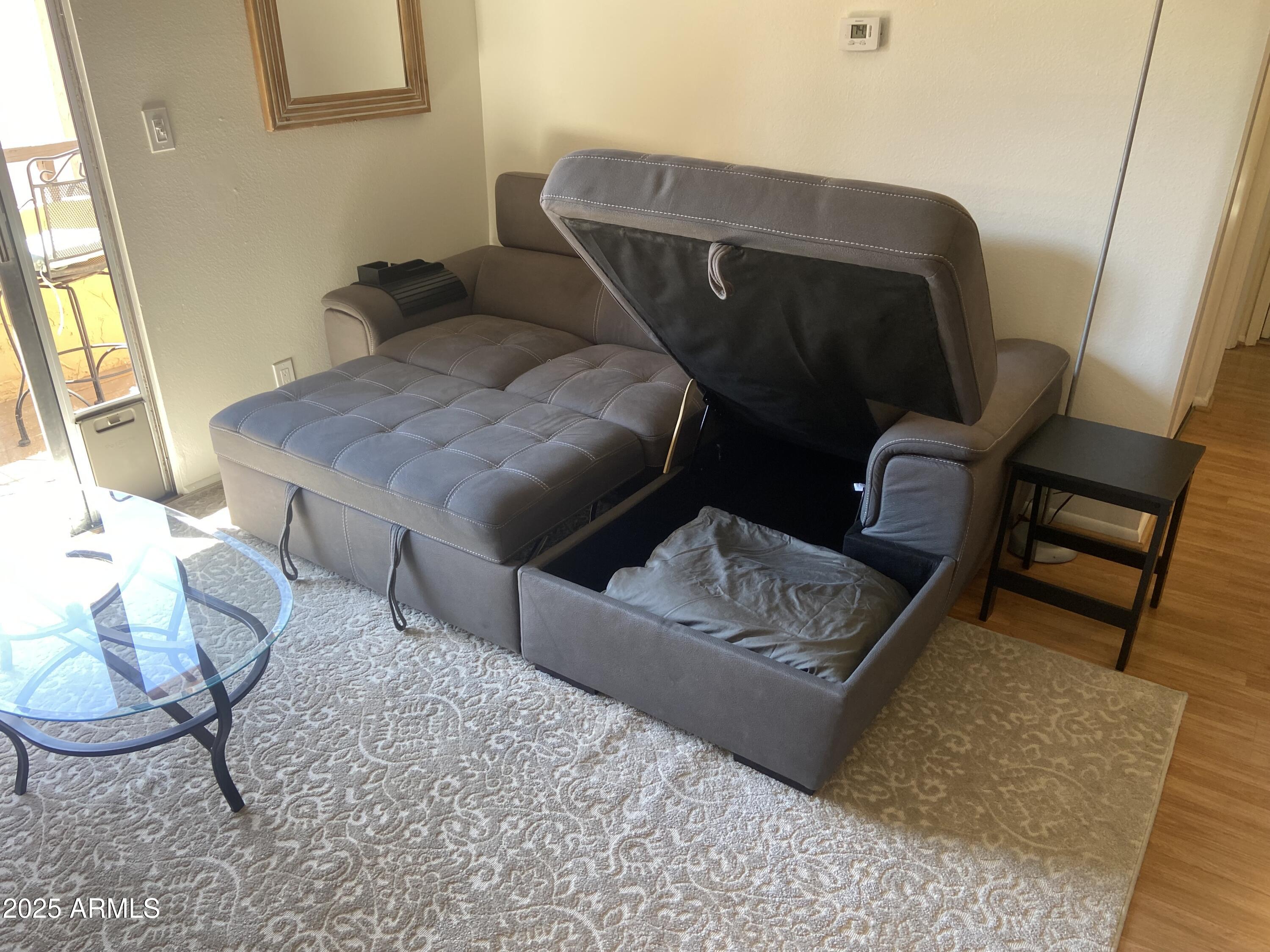 8055 East Thomas Road, Unit A303 Scottsdale, AZ 85251 - Photo 9 of 25 a living room with furniture