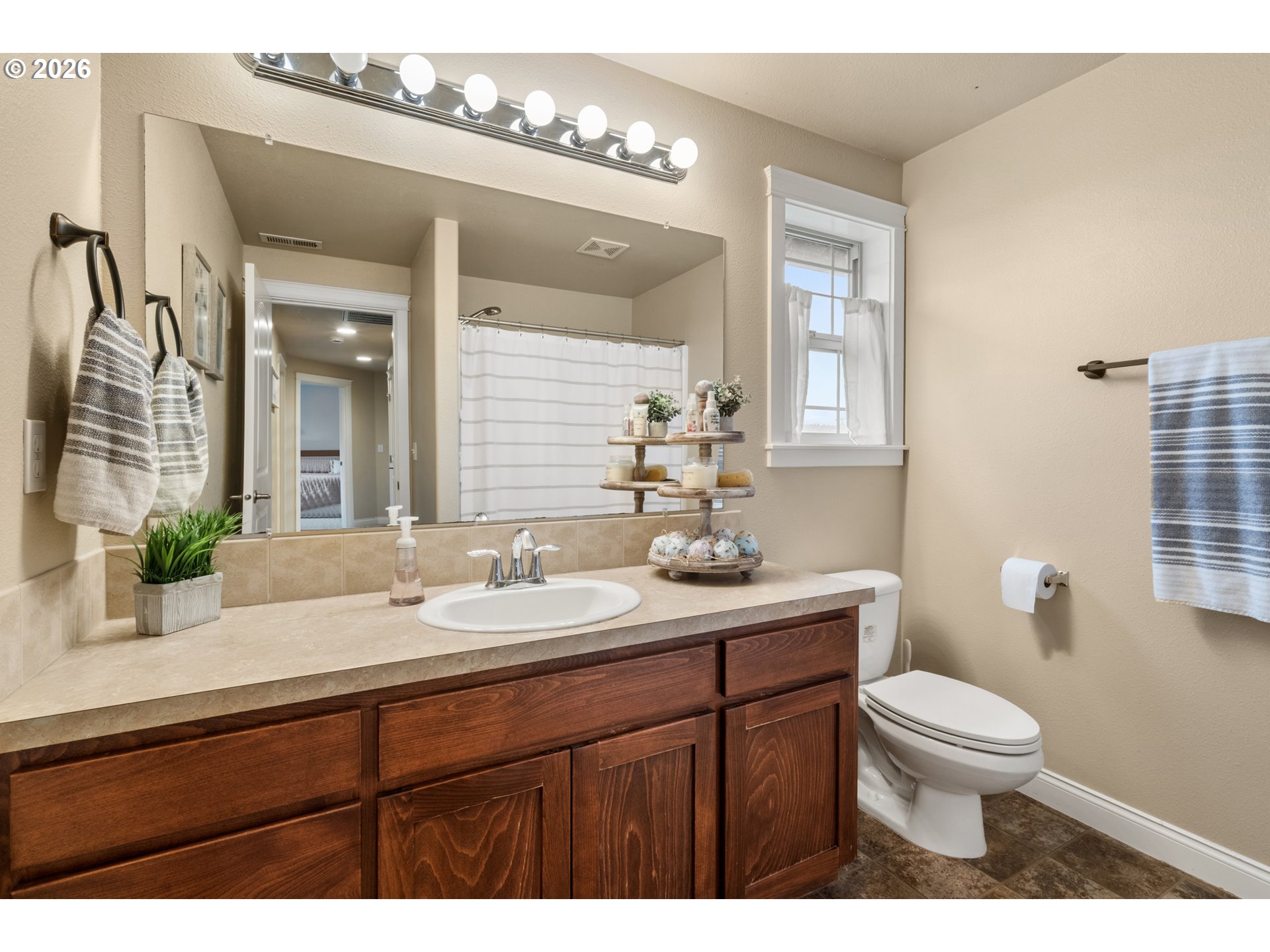 4971 Northeast Terri Lane Albany, OR 97321 - Photo 14 of 44 a bathroom with a toilet a sink and mirror