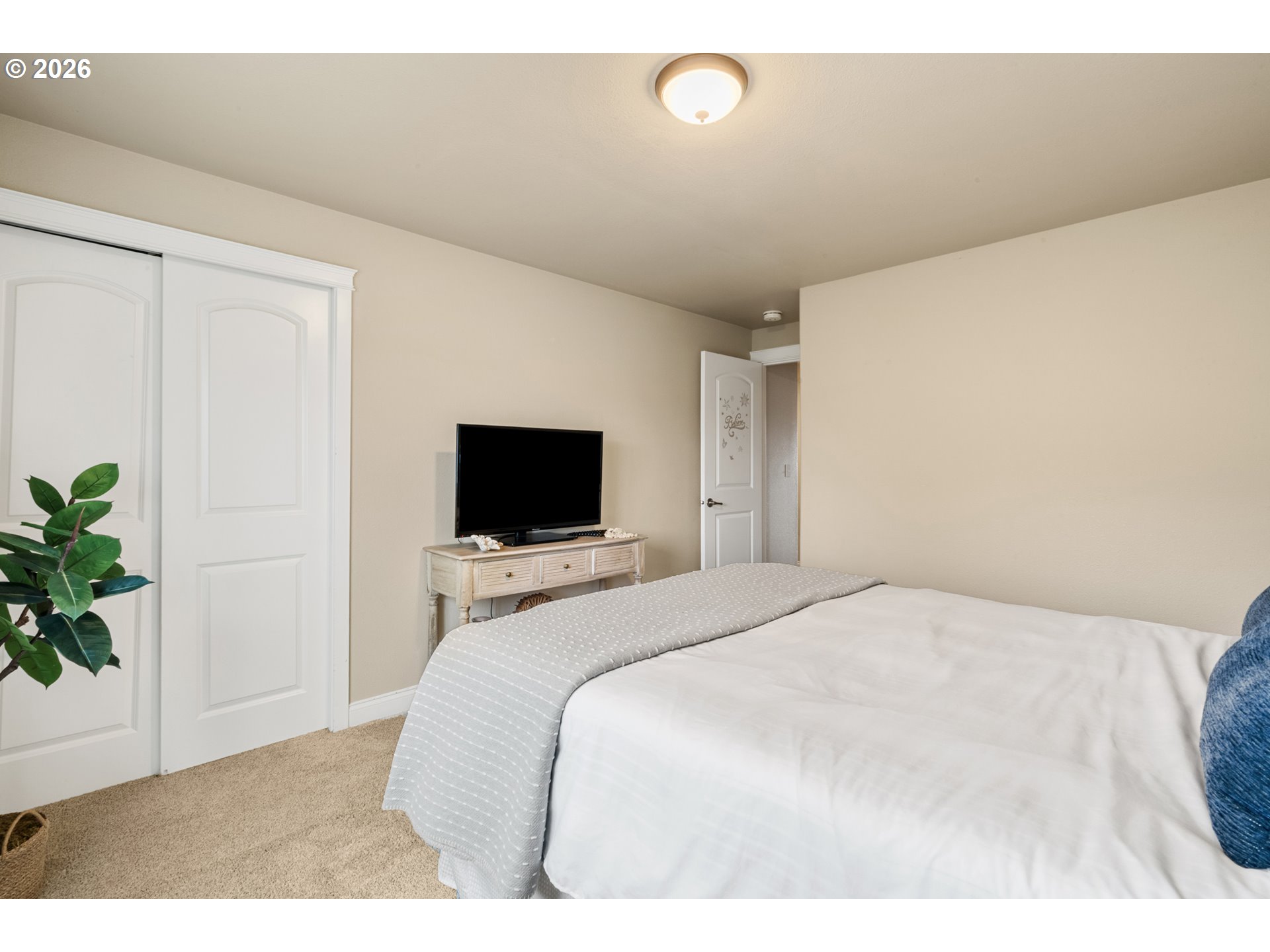 4971 Northeast Terri Lane Albany, OR 97321 - Photo 16 of 44 a bedroom with a bed and a television