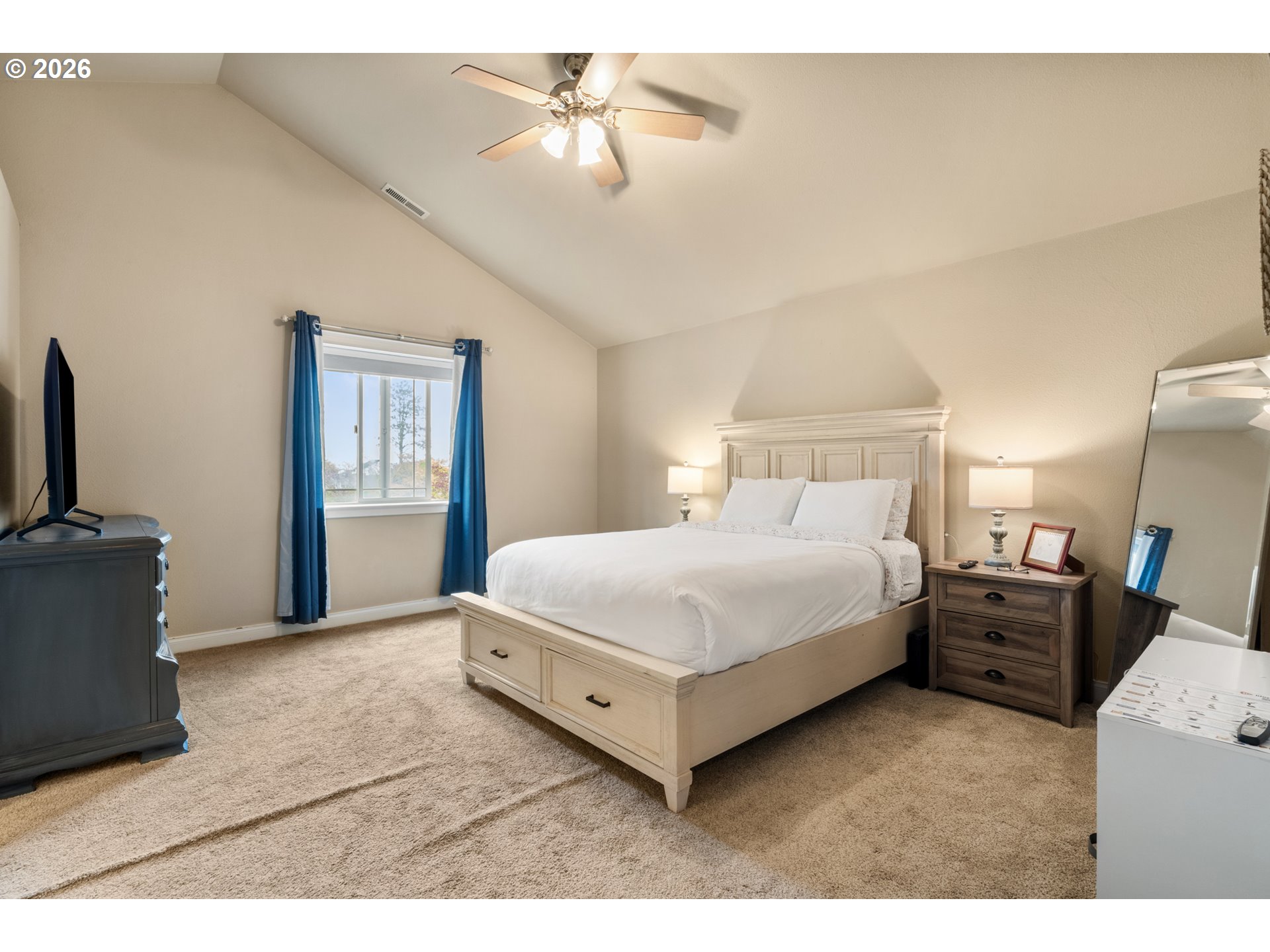 4971 Northeast Terri Lane Albany, OR 97321 - Photo 20 of 44 a bedroom with a bed and a chandelier