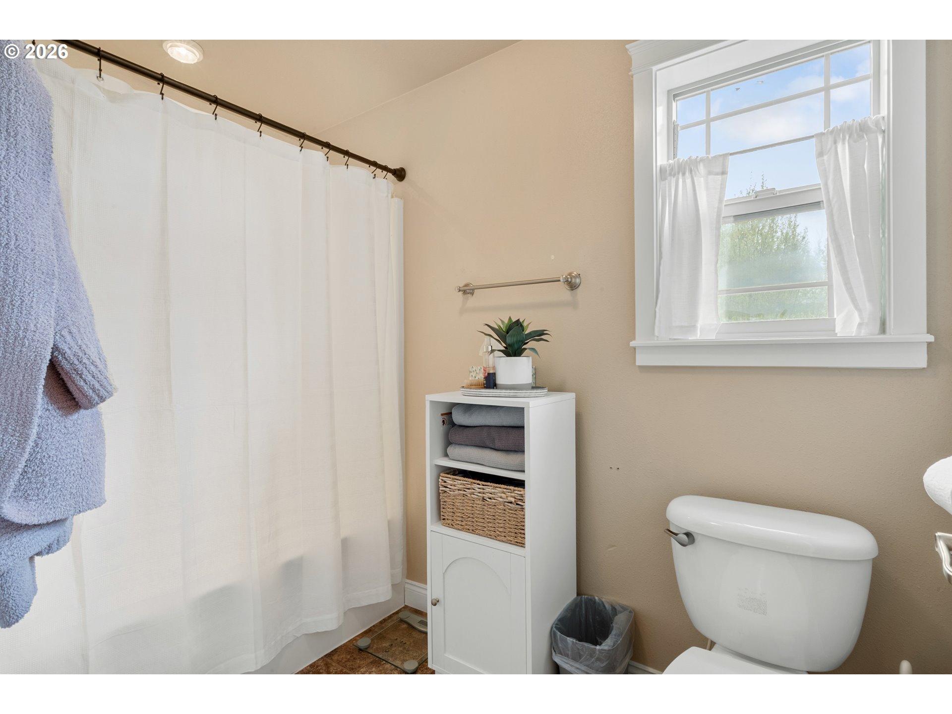 4971 Northeast Terri Lane Albany, OR 97321 - Photo 24 of 44 a bathroom with a toilet a sink and a window