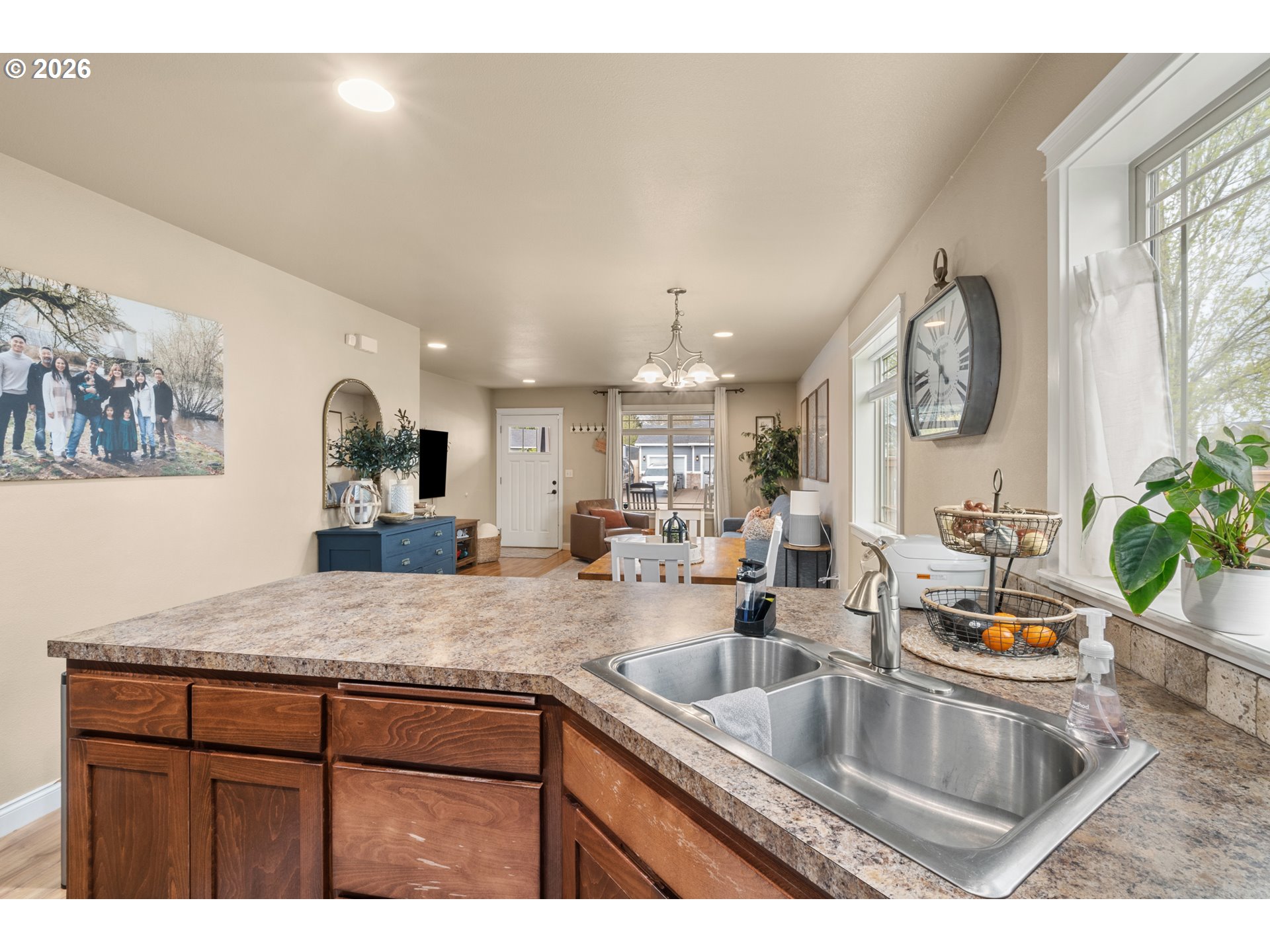 4971 Northeast Terri Lane Albany, OR 97321 - Photo 6 of 44 a kitchen with kitchen island granite countertop a sink and a wooden floors