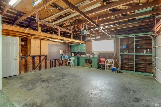 a view of empty room with wooden ceiling