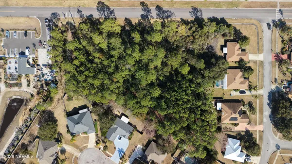 an aerial view of a houses with outdoor space