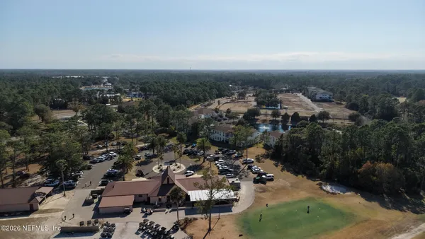 an aerial view of a house with a ocean view
