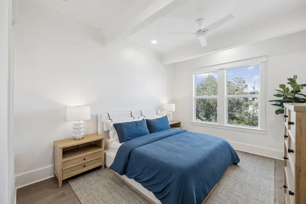 a living room with a couch and wooden floor