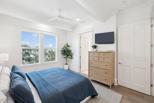 a room with furniture and view of kitchen