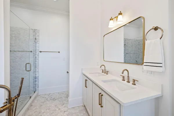 a view of a lake with lawn chairs