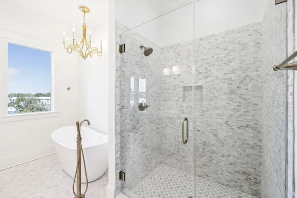 an aerial view of residential houses with outdoor space and parking