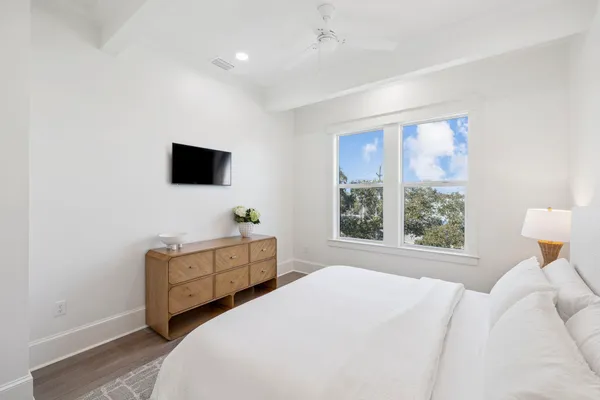 a view of a lake with boats and trees in the background