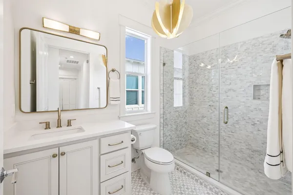 a view of a lake with boats and trees in the background