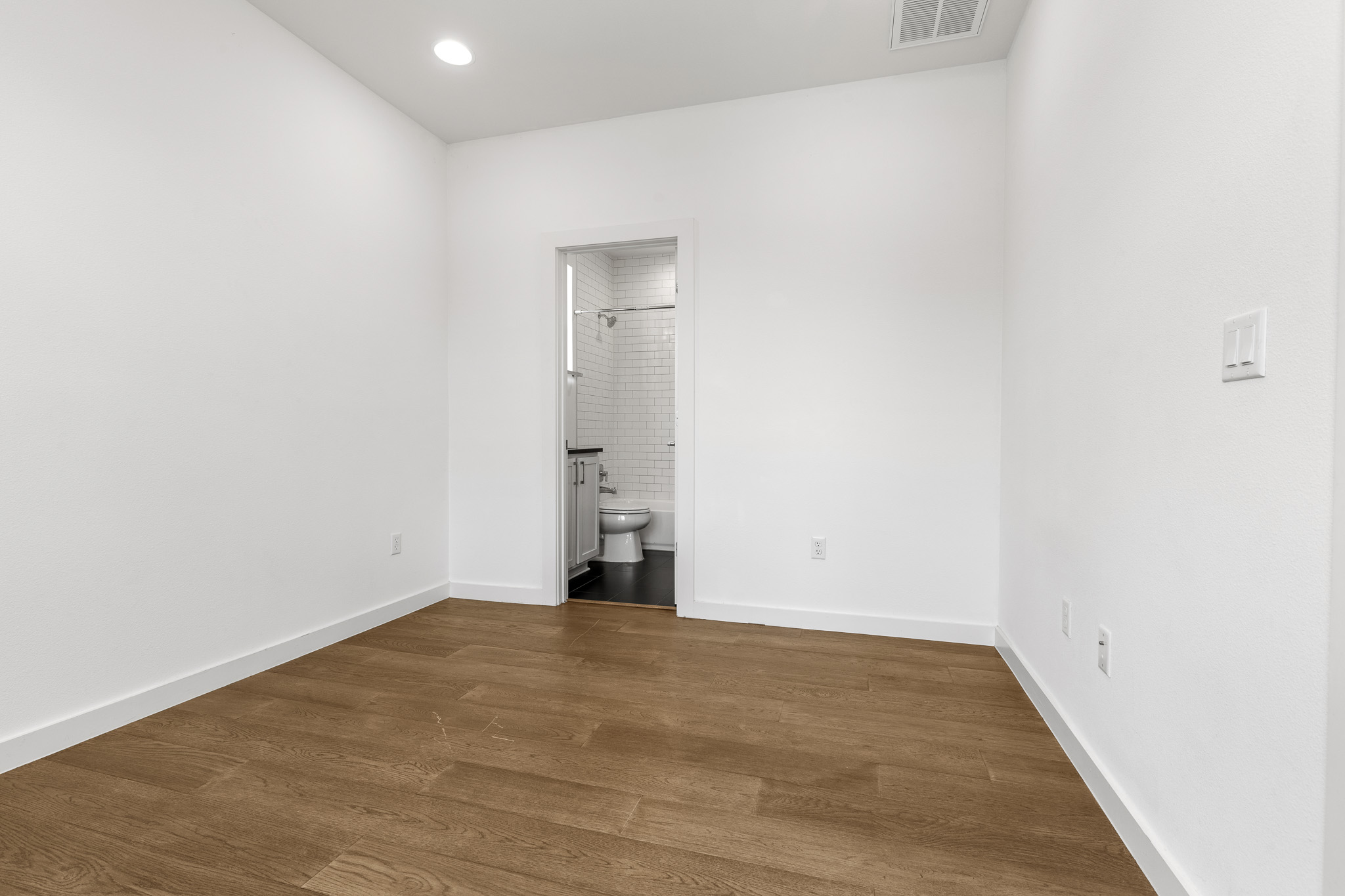 2604 Wheless Lane, Unit 1 Austin, TX 78723 - Photo 17 of 38 Spacious primary suite provides a true sanctuary with abundant windows and natural light.