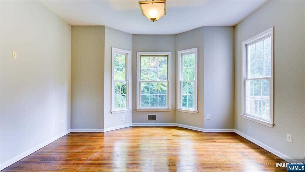15 Berry Court Flanders, NJ 07836 - Photo 27 of 48 a view of an empty room with wooden floor and a window