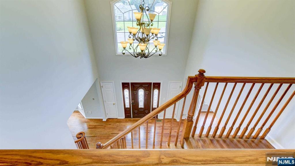 15 Berry Court Flanders, NJ 07836 - Photo 32 of 48 a view of entryway wooden floor and a chandelier