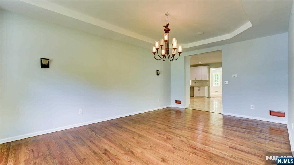 15 Berry Court Flanders, NJ 07836 - Photo 9 of 48 a view of an empty room with wooden floor and a window