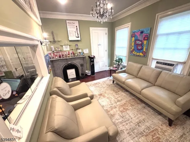 a bedroom with a bed couch and a window