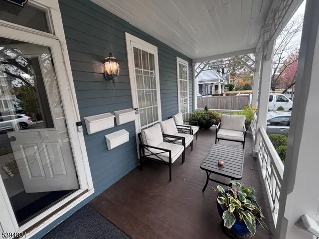 a living room with furniture fireplace and flat screen tv