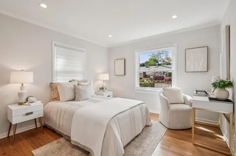 a bedroom with a bed and a couch