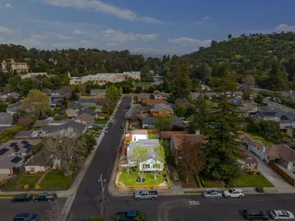 an aerial view of residential houses with outdoor space