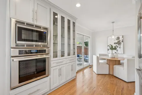 a kitchen with a stove oven and sink