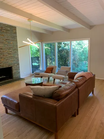 a living room with furniture and a fireplace