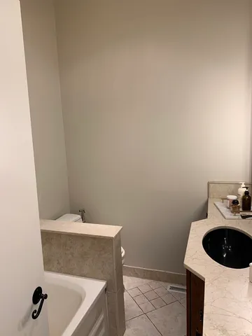 a bathroom with a sink and vanity