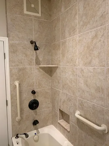 a bathroom with a sink and a shower