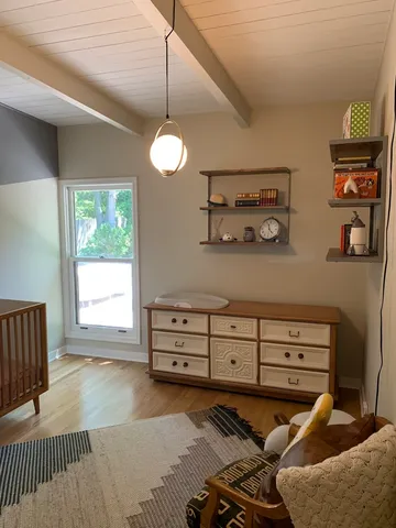 a view of a livingroom with furniture and window