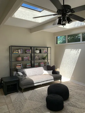 a bedroom with furniture and a potted plant
