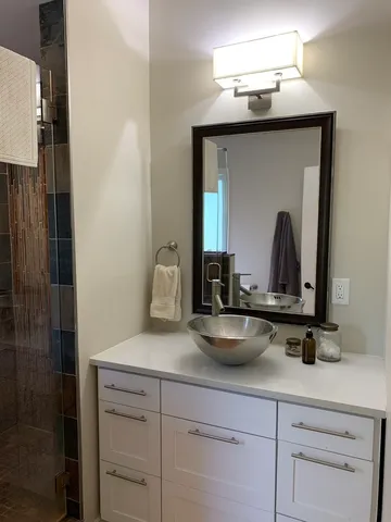 a bathroom with a sink and a mirror