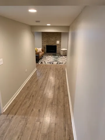a view of kitchen with sink and wooden floor