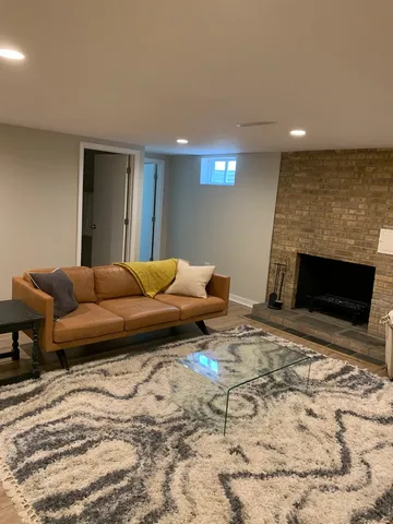 a living room with a couch and a fireplace