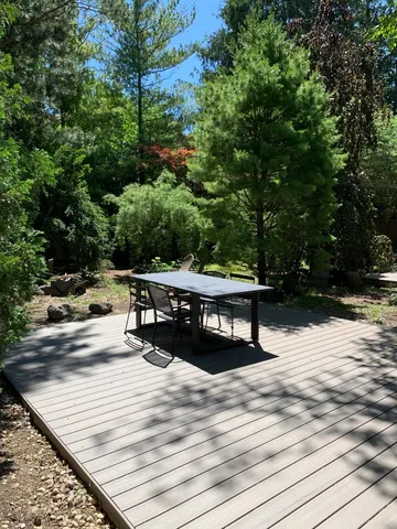 a view of swimming pool with sitting area