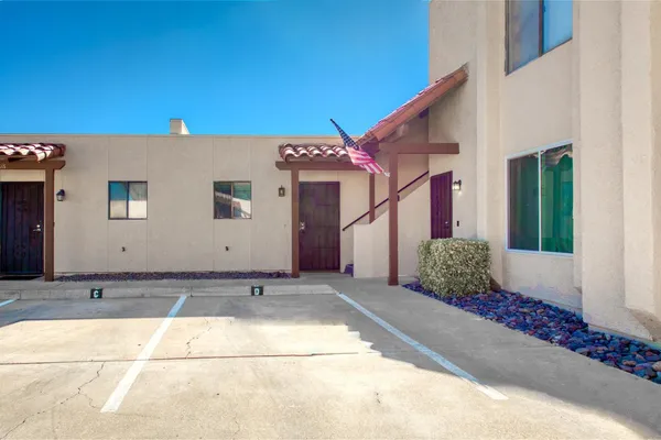 a front view of a house with a garage