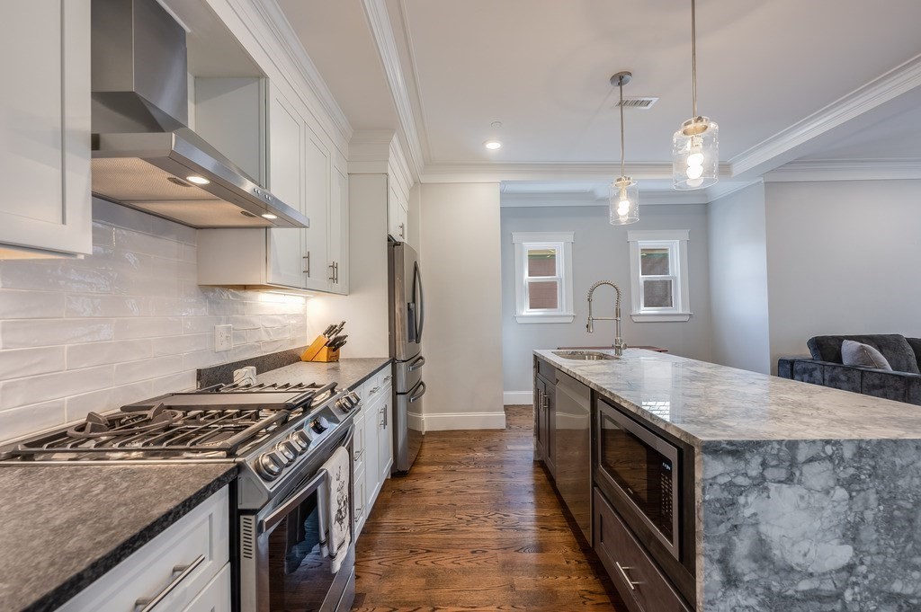 11 Preston Road, Unit 2 Somerville, MA 02143 - Photo 12 of 30 a kitchen with a stove and a sink