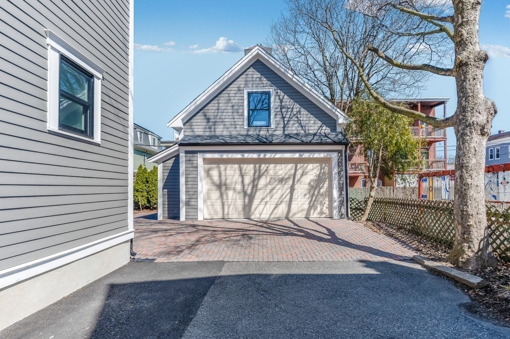 11 Preston Road, Unit 2 Somerville, MA 02143 - Photo 26 of 30 a front view of a house with garden