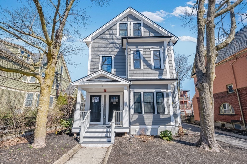 11 Preston Road, Unit 2 Somerville, MA 02143 - Photo 29 of 30 a front view of a house with a yard