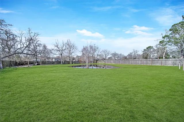 a view of field with trees in the background