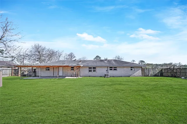 a view of a house with a yard and a big yard