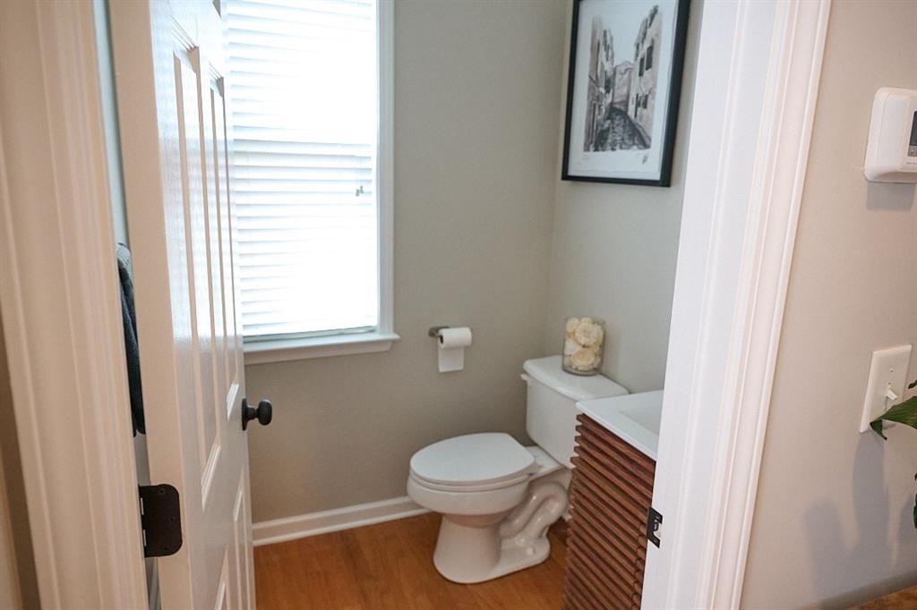 14183 Yacht Terrace Alpharetta, GA 30004 - Photo 14 of 30 a bathroom with a toilet and a shower curtain
