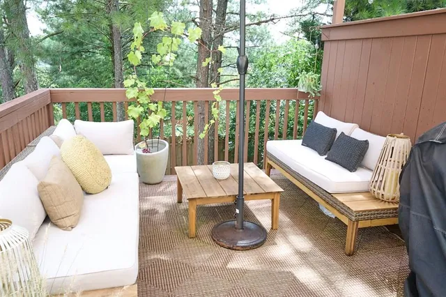 a bedroom with a bed and a potted plant