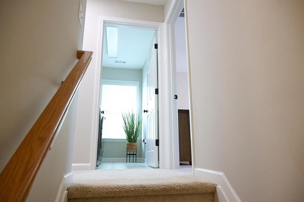 14183 Yacht Terrace Alpharetta, GA 30004 - Photo 16 of 30 a bedroom with a bed and a potted plant