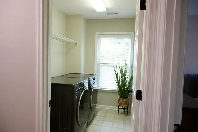 a view of a bathroom with a sink and mirror