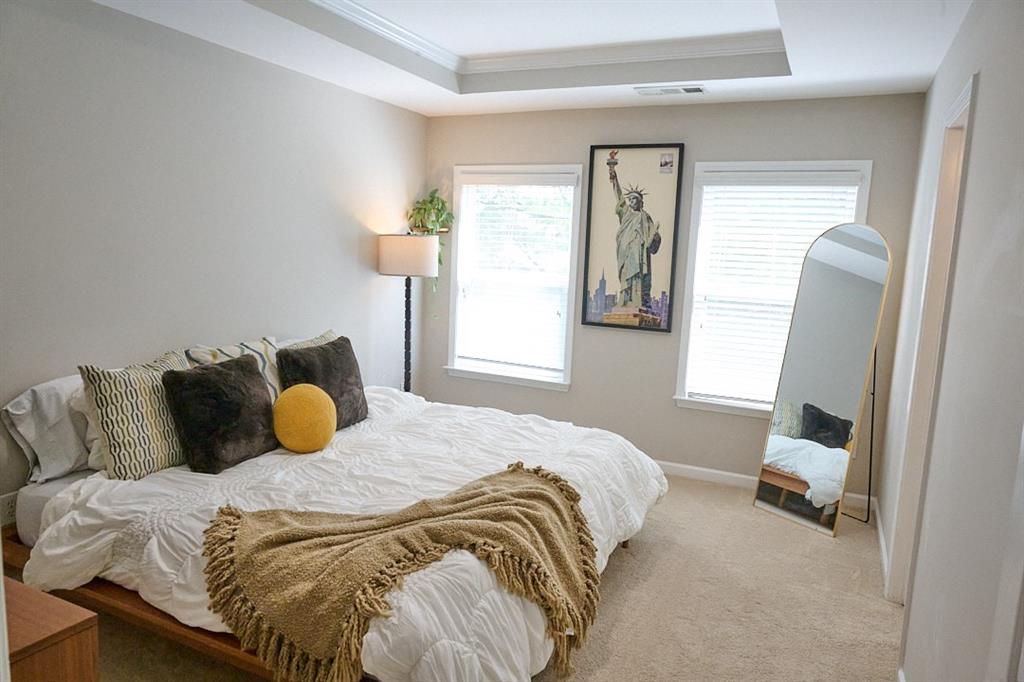 14183 Yacht Terrace Alpharetta, GA 30004 - Photo 19 of 30 a bedroom with a bed and window