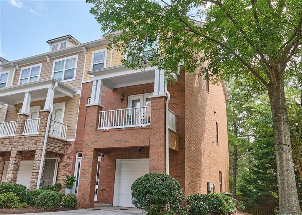 14183 Yacht Terrace Alpharetta, GA 30004 - Photo 2 of 30 a front view of a building with a tree