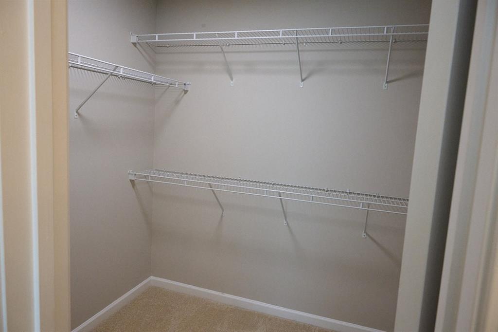 14183 Yacht Terrace Alpharetta, GA 30004 - Photo 23 of 30 a view of a room with racks on the wall